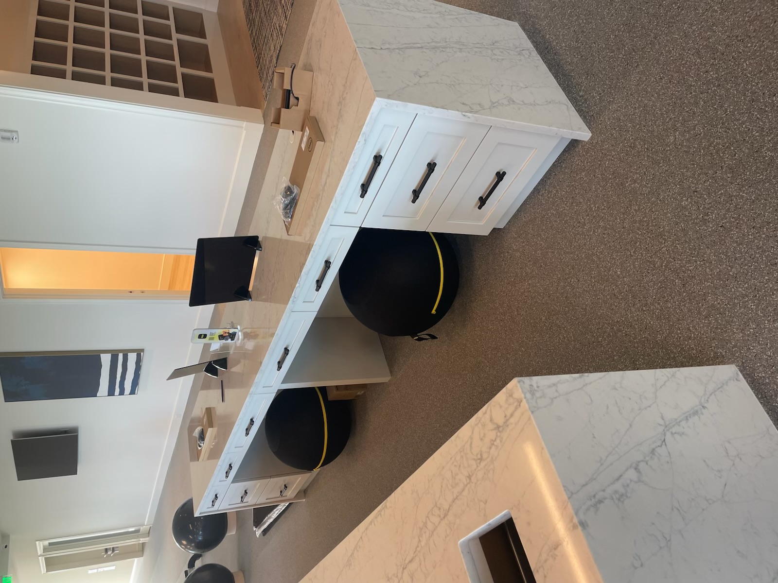 Custom millwork workstation checked for fit and geometry before final installation by ARTEC Woodworkers